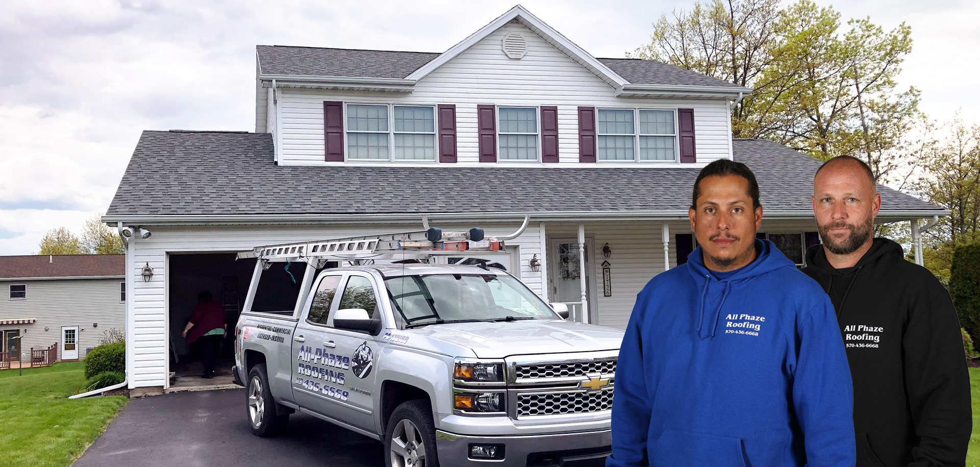 All Phaze crew members stand in front of their truck parked in front of a customer's home.